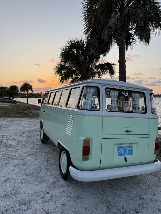 Darla the VW bus parked near the water at sunset