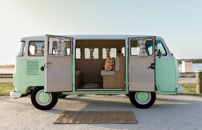 Darla the VW bus with both doors open, interior bench visible