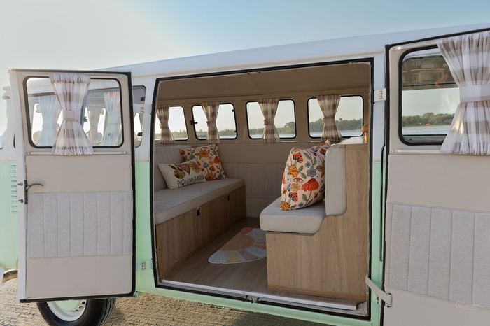 Close-up interior of Darla the VW bus through open doors