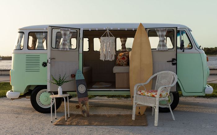Front view of Darla the VW bus with a surfboard and macrame hanging