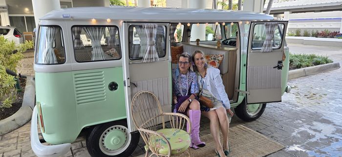 Two guests seated together in Darla's doorway