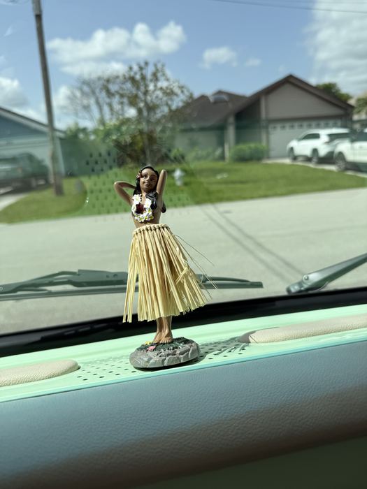Hula dancer dashboard ornament on Darla the VW bus